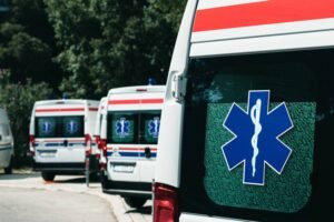 Row of white ambulances parked outdoors, representing emergency medical services available in and around Kalkan.