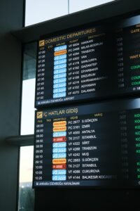 Domestic departures board at Ankara Esenboğa Airport showing flight options for travelling to Kalkan.