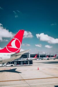 Turkish Airlines aircraft parked at an airport terminal, showing transport options for travelling to Kalkan.