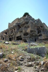 Ancient rock‑cut ruins at Tlos carved into a hillside near Kalkan.