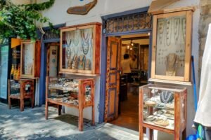 Kalkan jewellery shop exterior with wooden display cases showcasing handmade necklaces, bracelets and rings.