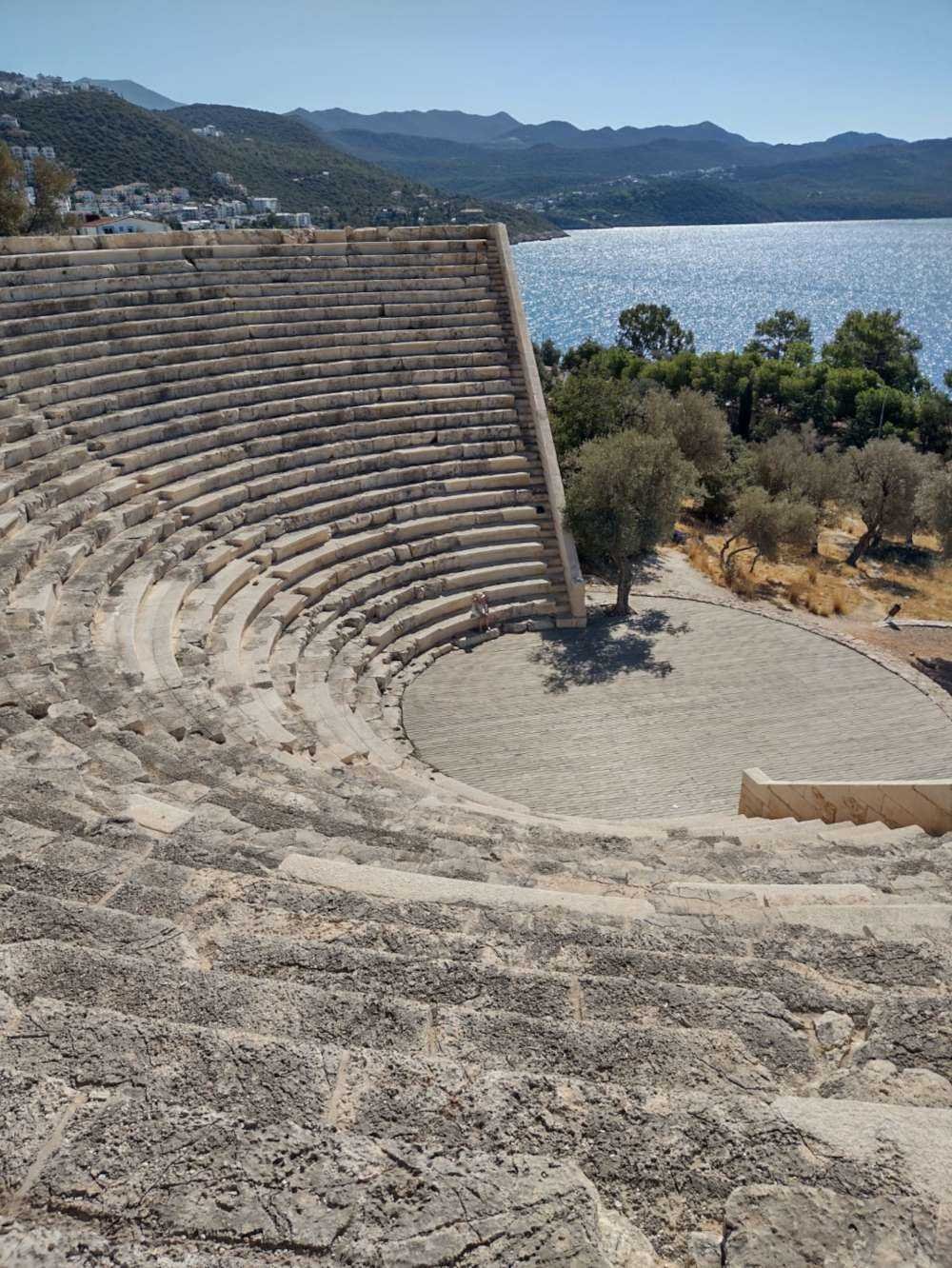 Ancient stone amphitheatre in Kaş overlooking the sea and surrounding mountains near Kalkan.